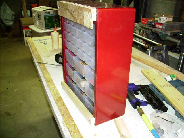 Wall system cleat on cabinet back.JPG